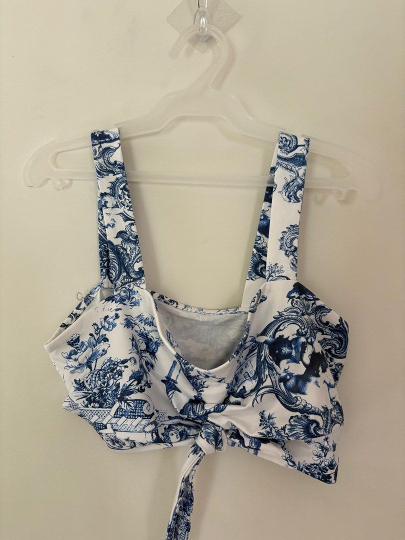 Blue and White Print Crop Top (Category: Others Tops) located in Imus. Submitted by collset (Listing ID 1404633769, Image 3). Description: - Blue and white printed crop top - Features a tie-front design - Wide straps - Made of lightweight fabric.