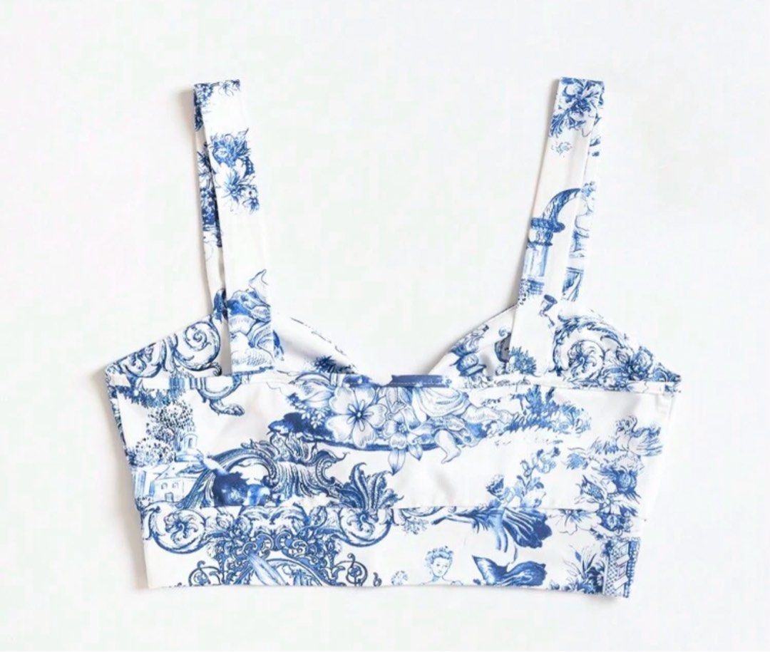 Blue and White Print Crop Top (Category: Others Tops) located in Imus. Submitted by collset (Listing ID 1404633769, Image 2). Description: - Blue and white printed crop top - Features a tie-front design - Wide straps - Made of lightweight fabric.