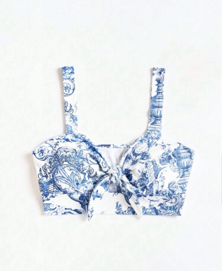 Blue and White Print Crop Top (Category: Others Tops) located in Imus. Submitted by collset (Listing ID 1404633769, Image 1). Description: - Blue and white printed crop top - Features a tie-front design - Wide straps - Made of lightweight fabric.
