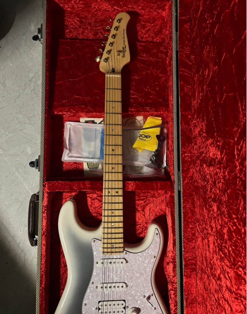 Electric Guitar (Stratocaster) (Category: Musical Instruments) located in Taguig. Submitted by justinepulido (Listing ID 1404681208, Image 3). Description: For sale: SQOE SEST900 (Electric Guitar) * Good as brand new (once lang nagamit for gig) * Fully Set Up * No issues * Aesthetic- 100% * Sound Quality- 100% - Free Strap, Cord, Picks and Hard case * Model: SEST900 * Body: Alder with a flame maple top * Neck: Canadian maple, slim C-shaped with 2