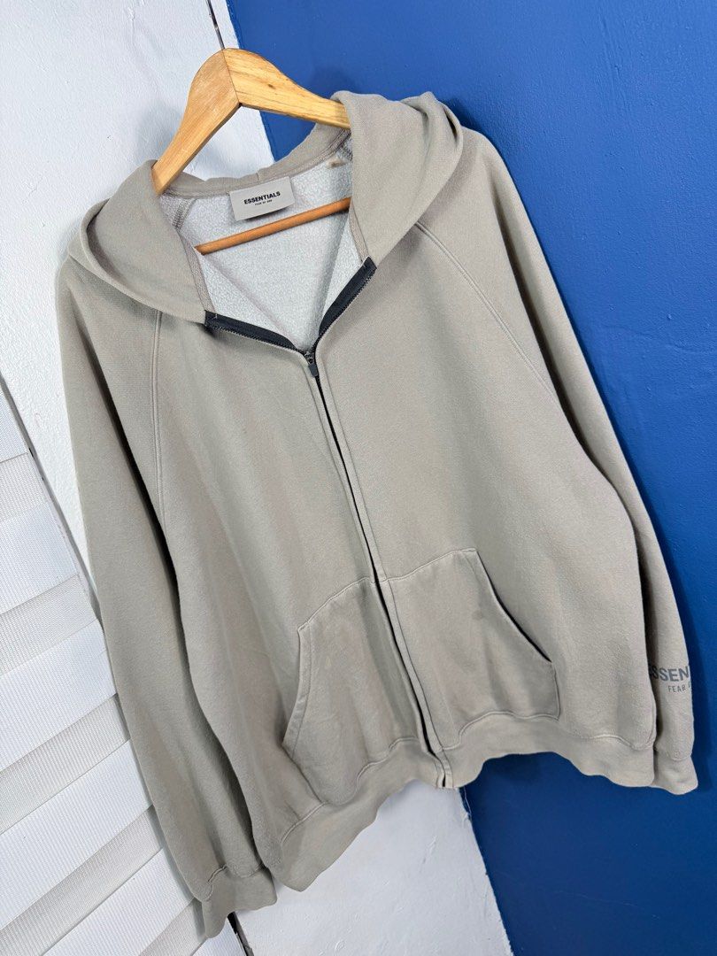Essentials Fear of God Zip Hoodie (Category: Hoodies) located in Pasig City. Submitted by trendapparelph (Listing ID 1404689532, Image 2). Description: Minimal flaw.