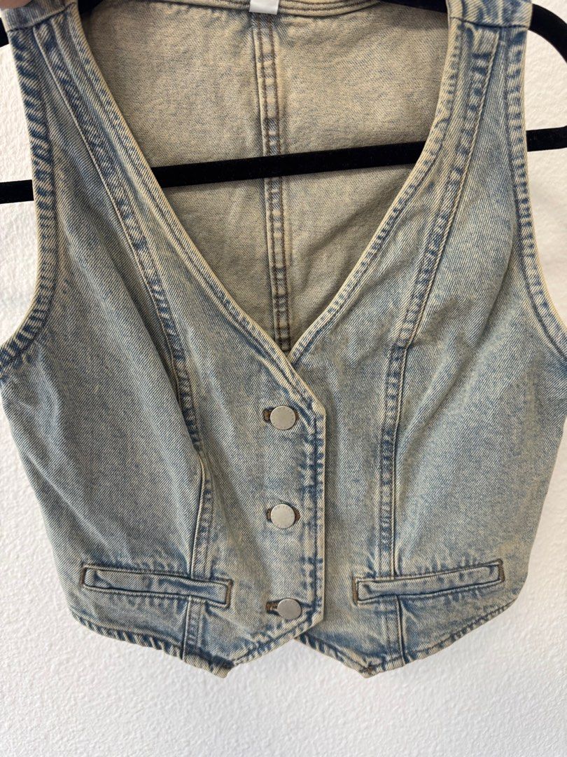 GU Denim Vest (Category: Vests) located in San Juan City. Submitted by baudeclutter (Listing ID 1404684256, Image 1). Description: - GU Denim Vest - Light Blue Wash - Cropped Length - V-neck - Button Closure - Two Front Pockets - New with Tag (Unworn).