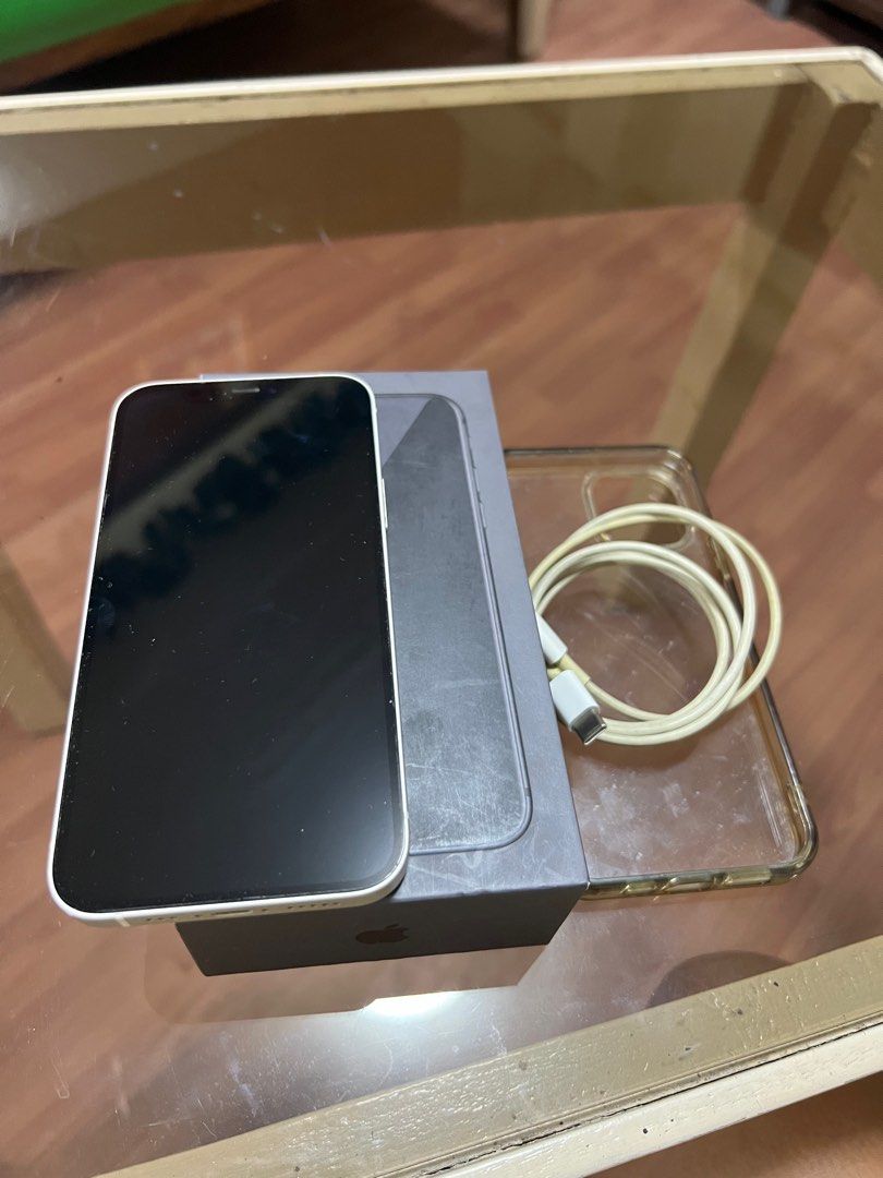 Iphone 12 64gb (Category: iPhone 12 Series) located in Cebu City. Submitted by markid0956 (Listing ID 1404615137, Image 3). Description: 64gb White Factory Unlock Battery Health: 71% Still very good battery Issue: Charging port sometimes takes extra effort to charge. Reason for selling: Extra With Cord, Box. .