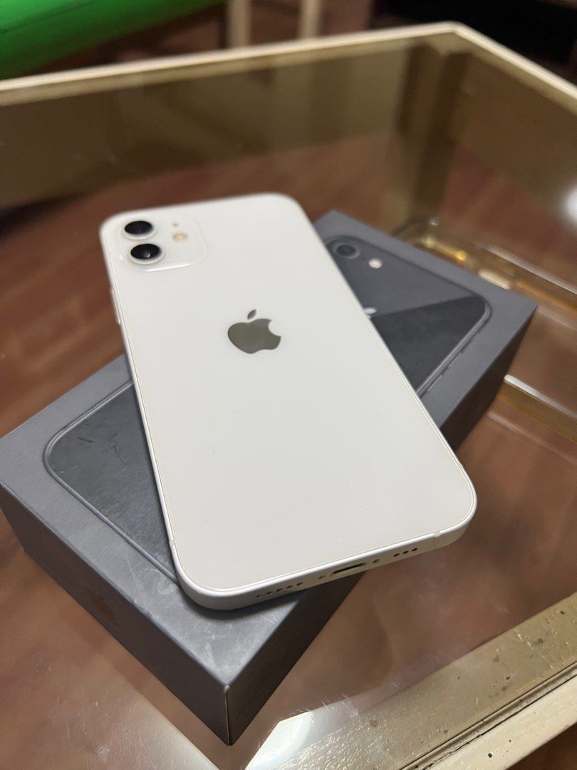 Iphone 12 64gb (Category: iPhone 12 Series) located in Cebu City. Submitted by markid0956 (Listing ID 1404615137, Image 2). Description: 64gb White Factory Unlock Battery Health: 71% Still very good battery Issue: Charging port sometimes takes extra effort to charge. Reason for selling: Extra With Cord, Box. .