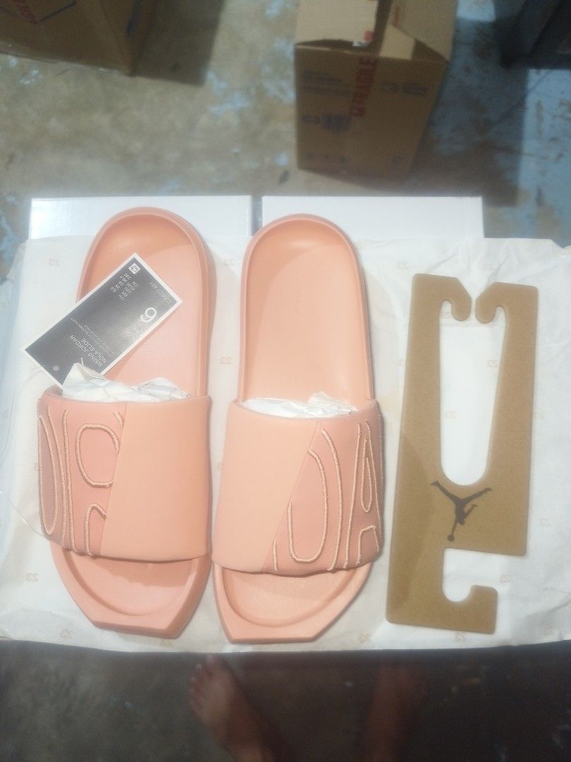 Jordan Break Slides - Peach (Category: Flats & Sandals) located in Manila. Submitted by basiclang (Listing ID 1404706094, Image 2). Description: - Jordan Break Slides in peach - Perfect for casual wear - Features the iconic Jordan logo - Comes with original tag and cardboard hanger - Size clearly indicated on the tag - Comfortable and stylish design - jordan nola slide - size 9women -26cm -1495 below SRP.