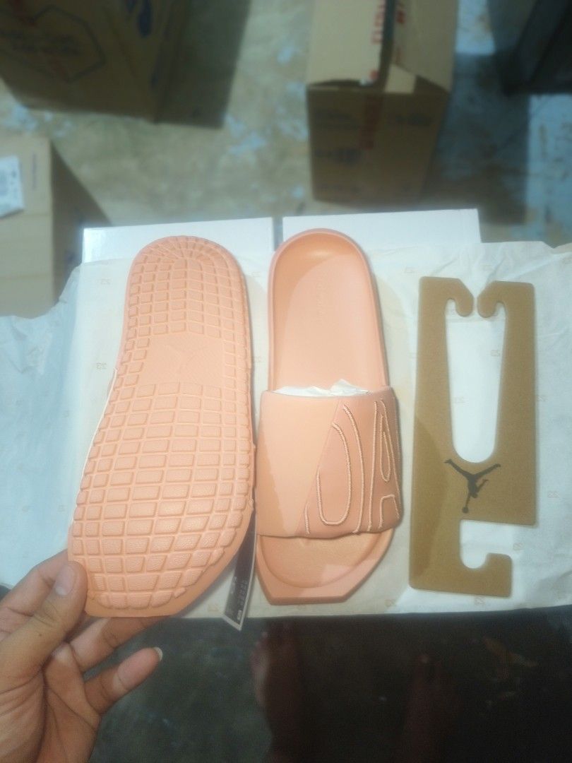 Jordan Break Slides - Peach (Category: Flats & Sandals) located in Manila. Submitted by basiclang (Listing ID 1404706094, Image 3). Description: - Jordan Break Slides in peach - Perfect for casual wear - Features the iconic Jordan logo - Comes with original tag and cardboard hanger - Size clearly indicated on the tag - Comfortable and stylish design - jordan nola slide - size 9women -26cm -1495 below SRP.