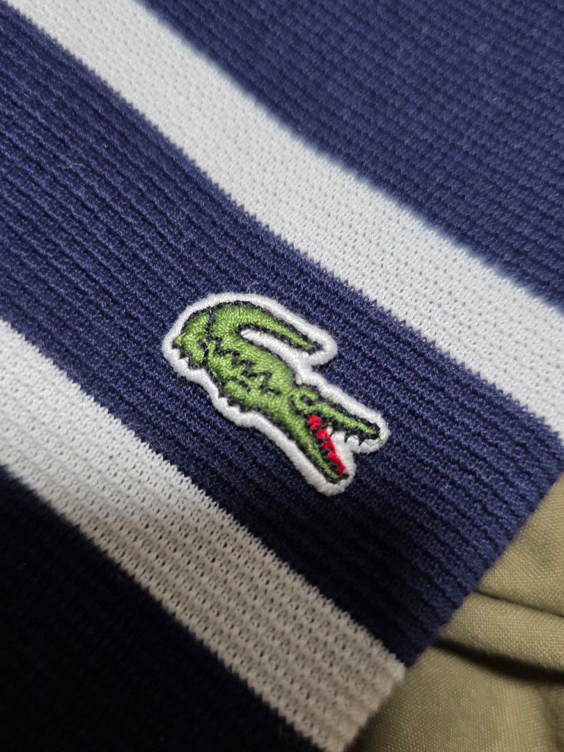 Lacoste Striped T-shirt (Category: Tshirts & Polo Shirts ) located in Quezon City. Submitted by yGGGG (Listing ID 1404738341, Image 3). Description: - Lacoste T-shirt - Navy blue and white stripes - Green crocodile logo - Crew neck with blue accent - Size 4 (20x27) - 100% cotton - Short sleeves.