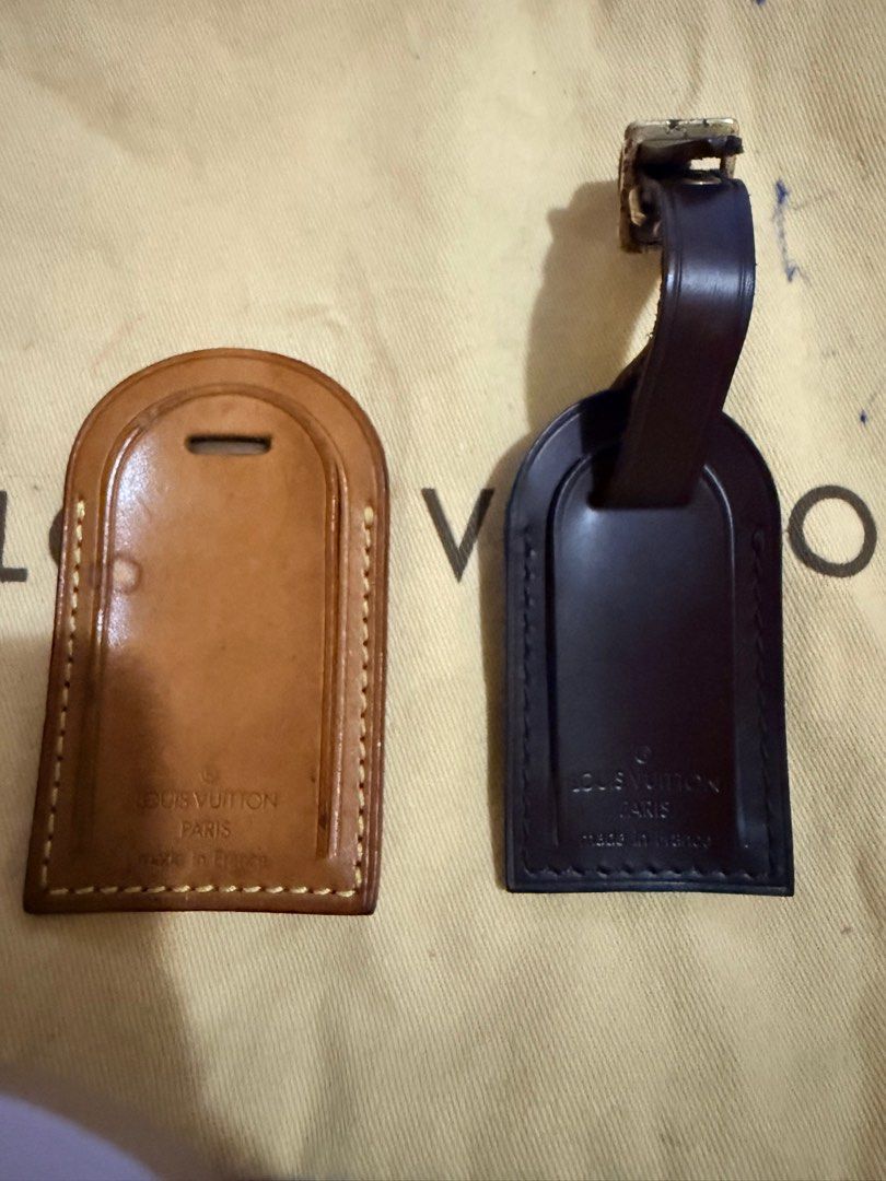 Louis Vuitton Luggage Tag (Category: Luxury Bags & Wallets) located in Marikina City. Submitted by anndergroundmarket (Listing ID 1404661078, Image 1). Description: Authentic Louis Vuitton luggage tag. Features the Louis Vuitton Paris logo and "made in France" inscription. Includes a brown leather tag and a black leather tag with a buckle. The tags have a rectangular shape with rounded top edges and a slot for the strap..