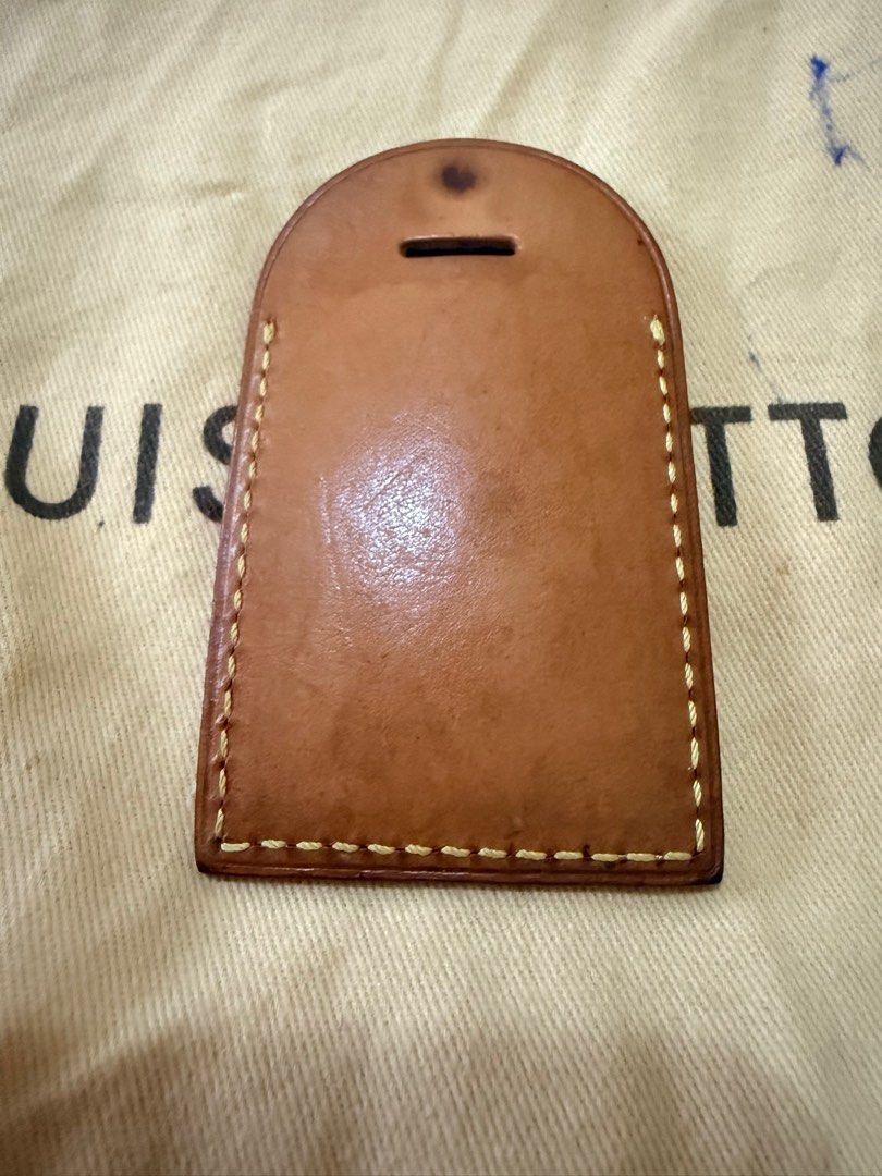 Louis Vuitton Luggage Tag (Category: Luxury Bags & Wallets) located in Marikina City. Submitted by anndergroundmarket (Listing ID 1404661078, Image 3). Description: Authentic Louis Vuitton luggage tag. Features the Louis Vuitton Paris logo and "made in France" inscription. Includes a brown leather tag and a black leather tag with a buckle. The tags have a rectangular shape with rounded top edges and a slot for the strap..