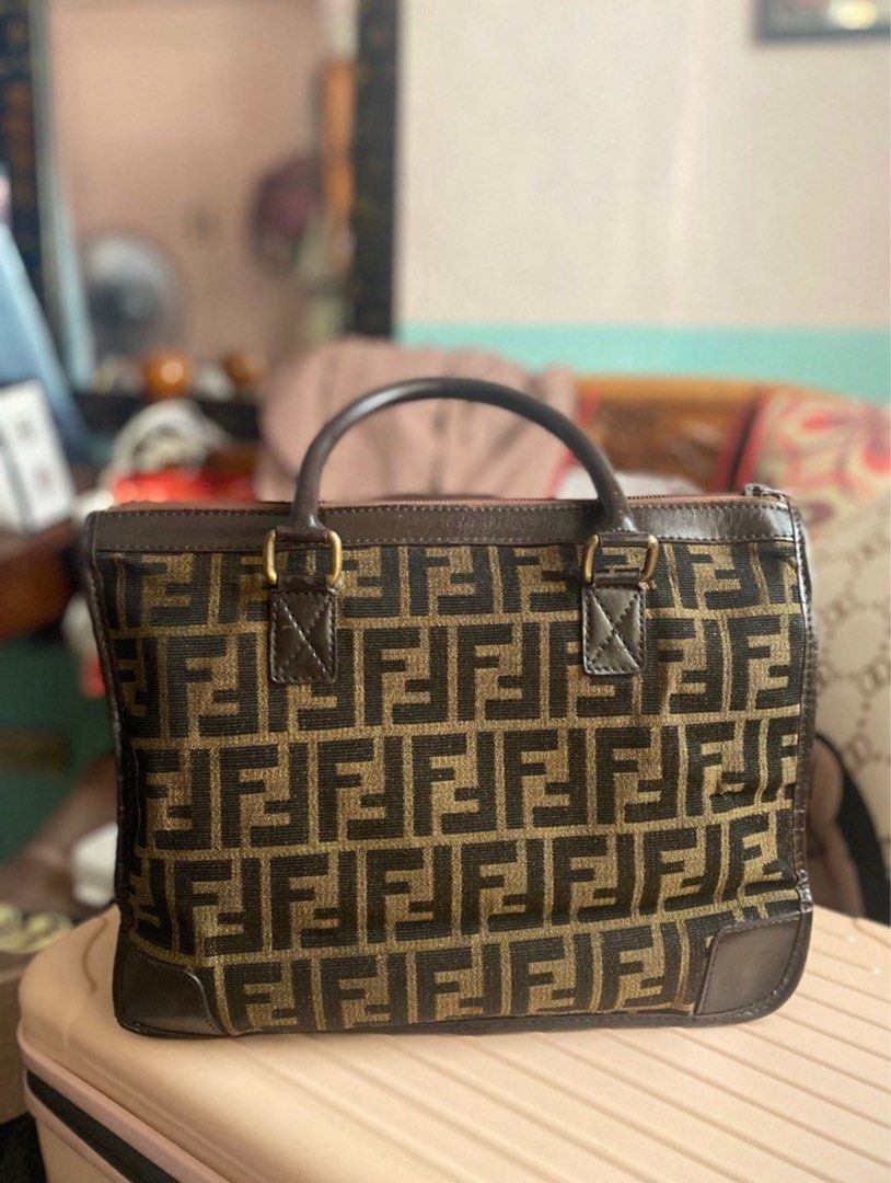 ORIGINAL FENDI ZUCCA BAG (Category: Luxury Bags & Wallets) located in Quezon City. Submitted by anneglico (Listing ID 1404754911, Image 2). Description: 100% authentic since it’s from Japan • The bag is too old or vintage to be replicated • Bag only + free bag organizer • With minimal issues as I already restored the bag RFS: Declutter MOP: Gcash/Bank transfer MOD: Grab delivery/Lalamove within Metro Manila. LBC if province. Buyer must pay for th
