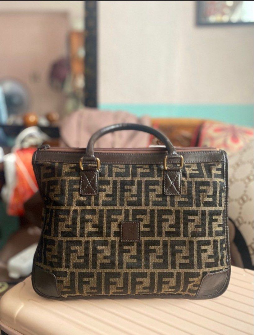 ORIGINAL FENDI ZUCCA BAG (Category: Luxury Bags & Wallets) located in Quezon City. Submitted by anneglico (Listing ID 1404754911, Image 1). Description: 100% authentic since it’s from Japan • The bag is too old or vintage to be replicated • Bag only + free bag organizer • With minimal issues as I already restored the bag RFS: Declutter MOP: Gcash/Bank transfer MOD: Grab delivery/Lalamove within Metro Manila. LBC if province. Buyer must pay for th