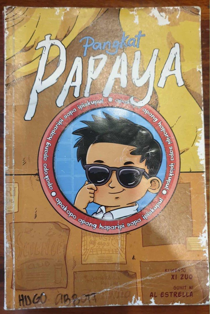 Pangkat Papaya Book (Category: Children's Books) located in Mandaluyong City. Submitted by abbottworks (Listing ID 1404626366, Image 1). Description: - "Pangkat Papaya" book by Hugo Abbott - Illustrated by Al Estrella - Features a cartoon boy with sunglasses on the cover - Pre-owned condition - Shows wear and tear on the edges.