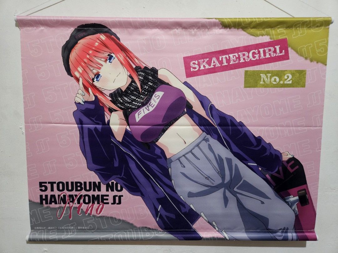 Quintuplets Nino Nakano B2 Tapestry (Category: Wall Decor) located in Dagupan City. Submitted by seleiya (Listing ID 1404684255, Image 1). Description: Wall scroll features Nino Nakano from the anime series 5-Toubun no Hanayome. It depicts Nino in a skater girl outfit. The scroll has a pink background with the series title and character name. It includes a hanging mechanism at the top for easy display..