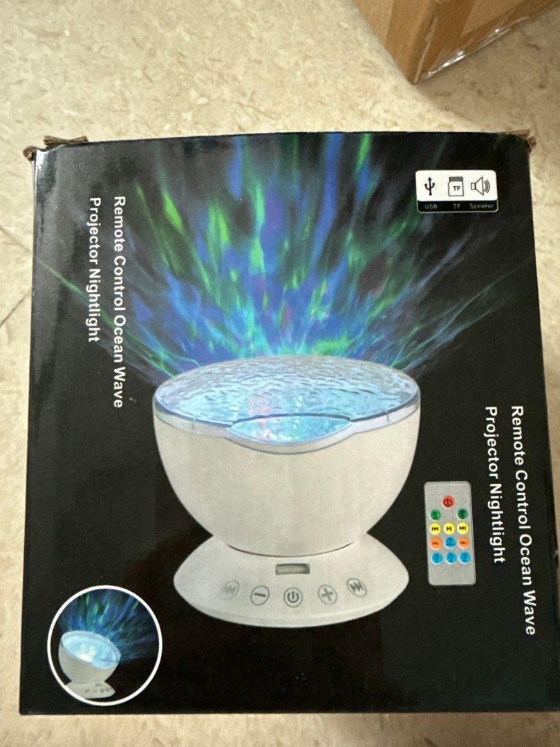 Remote Control Ocean Wave Projector Nightlight (Category: Projectors) located in Singapore. Submitted by danielyeow80 (Listing ID 1404597649, Image 2). Description: - Ocean Wave Projector Nightlight - Projects relaxing ocean wave patterns - Built-in speaker - Connects to mobile phones, computers, TF cards, and tablets - Made in China.