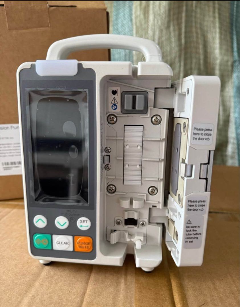 SpirMed Infusion Pump (Category: Medical Supplies & Tools) located in Manila. Submitted by kirstennv (Listing ID 1404761693, Image 2). Description: - SpirMed infusion pump - Digital display with flow rate and volume indicators - Control buttons for easy settings - Portable design with a convenient handle - Comes with the original box - Box includes weight and dimension information.
