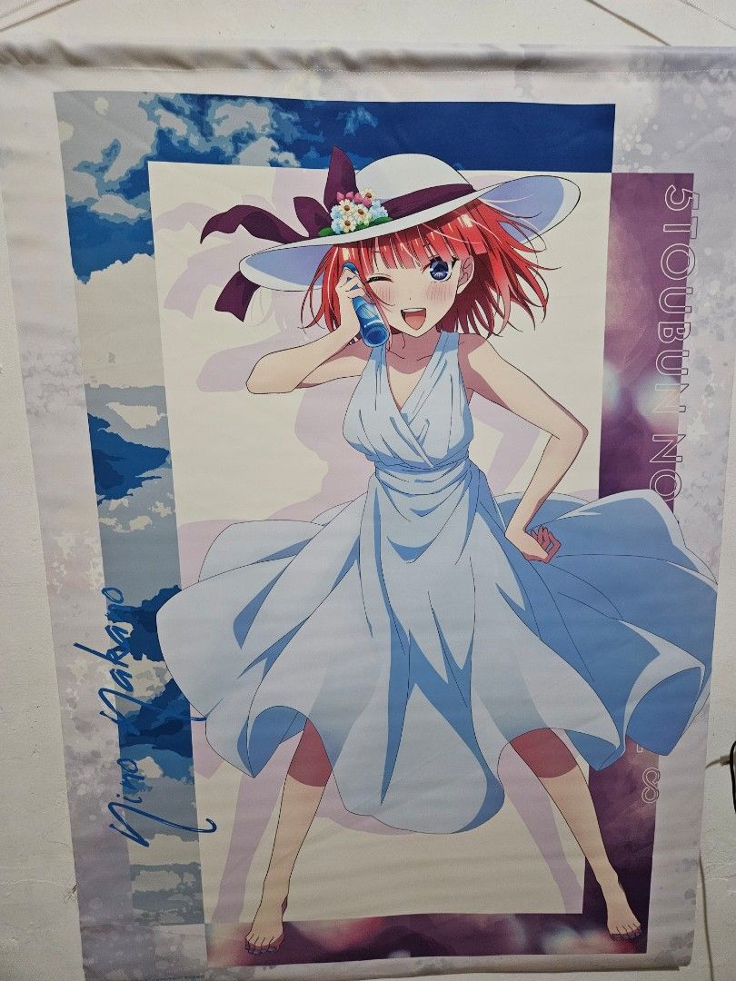 Quintuplets Nino Nakano B1 Tapestry (Category: Art & Prints) located in Dagupan City. Submitted by seleiya (Listing ID 1404684380, Image 1). Description: Poster features Nino Nakano from The Quintessential Quintuplets anime series. It showcases Nino in a light blue dress and a white hat. The poster has the name "Nino Nakano" written on it. The background has a mix of blue and purple colors. It's a great item for fans of the series..
