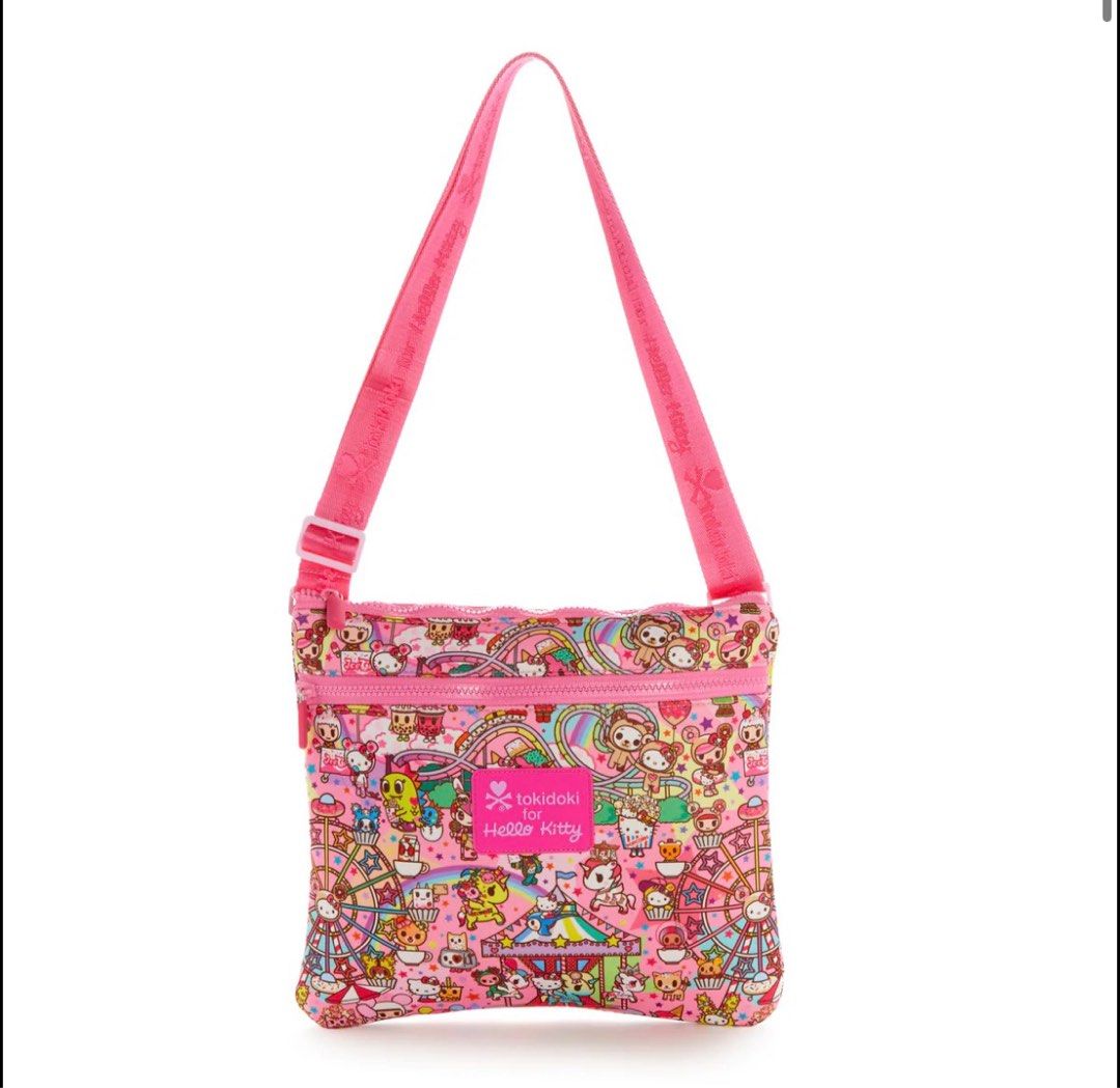 Tokidoki x Hello Kitty Crossbody Bag (Category: Cross-body Bags) located in Marilao. Submitted by paulasia87 (Listing ID 1404694291, Image 1). Description: - Adorable Tokidoki x Kitty crossbody bag. - Vibrant pink color. - Fun carnival-themed print. - Adjustable pink strap. - Zippered main compartment. - Perfect for carrying essentials..