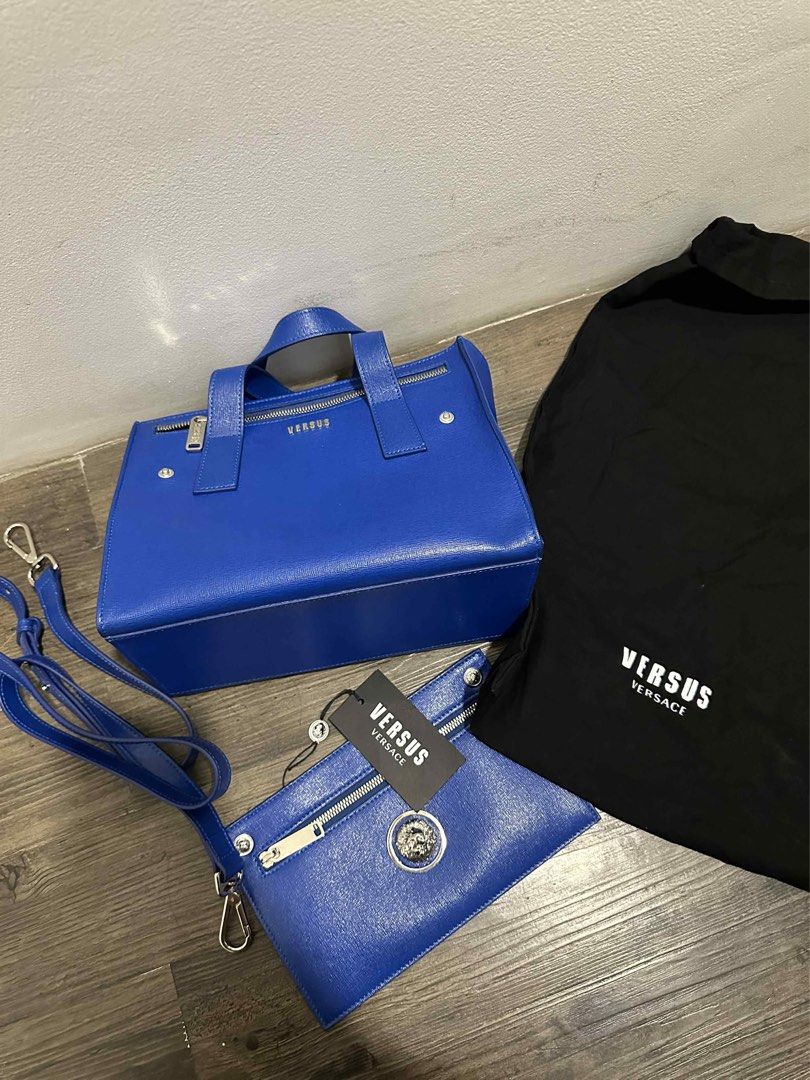 Versus Versace Blue Handbag Set (Category: Luxury Bags & Wallets) located in Santa Rosa. Submitted by imjzcarta (Listing ID 1404593329, Image 2). Description: - Versus by Versace handbag set - Vibrant blue color - Includes: - Tote bag with top handles and zip closure - Clutch with zip closure and Versace logo detail - Shoulder strap - Dust bag - Complete set with original accessories USED TWICE. MADE IN ITALY..