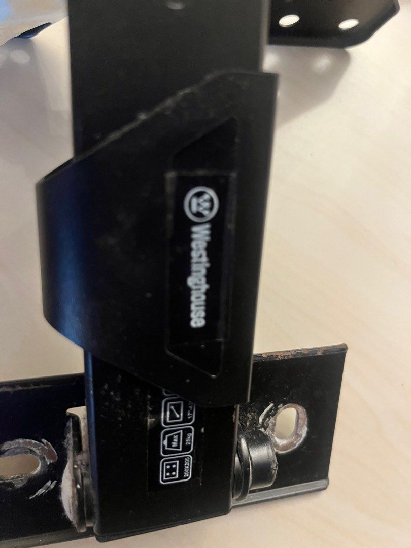 Westinghouse TV Wall Mount (Category: TV Parts & Accessories) located in Manila. Submitted by kilogramdynamite (Listing ID 1404769715, Image 3). Description: - Westinghouse TV wall mount - Includes main bracket and two extension arms - Color: Black - Condition: Good - Securely holds your TV on the wall - Space-saving and aesthetically pleasing.