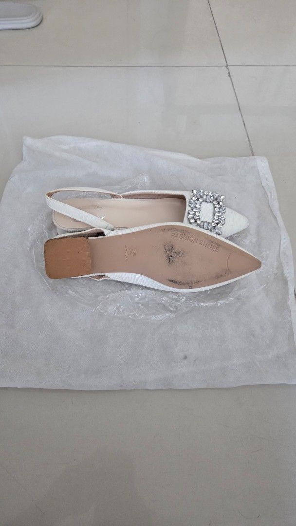 White Slingback Heels with Rhinestone Buckle (Category: Heels) located in Quezon City. Submitted by donbarero (Listing ID 1404611253, Image 2). Description: - White slingback heels - Pointed toe - Sparkling rhinestone buckle - Low block heel for comfort - Unworn condition - Comes with original packaging - Ideal for special occasions.