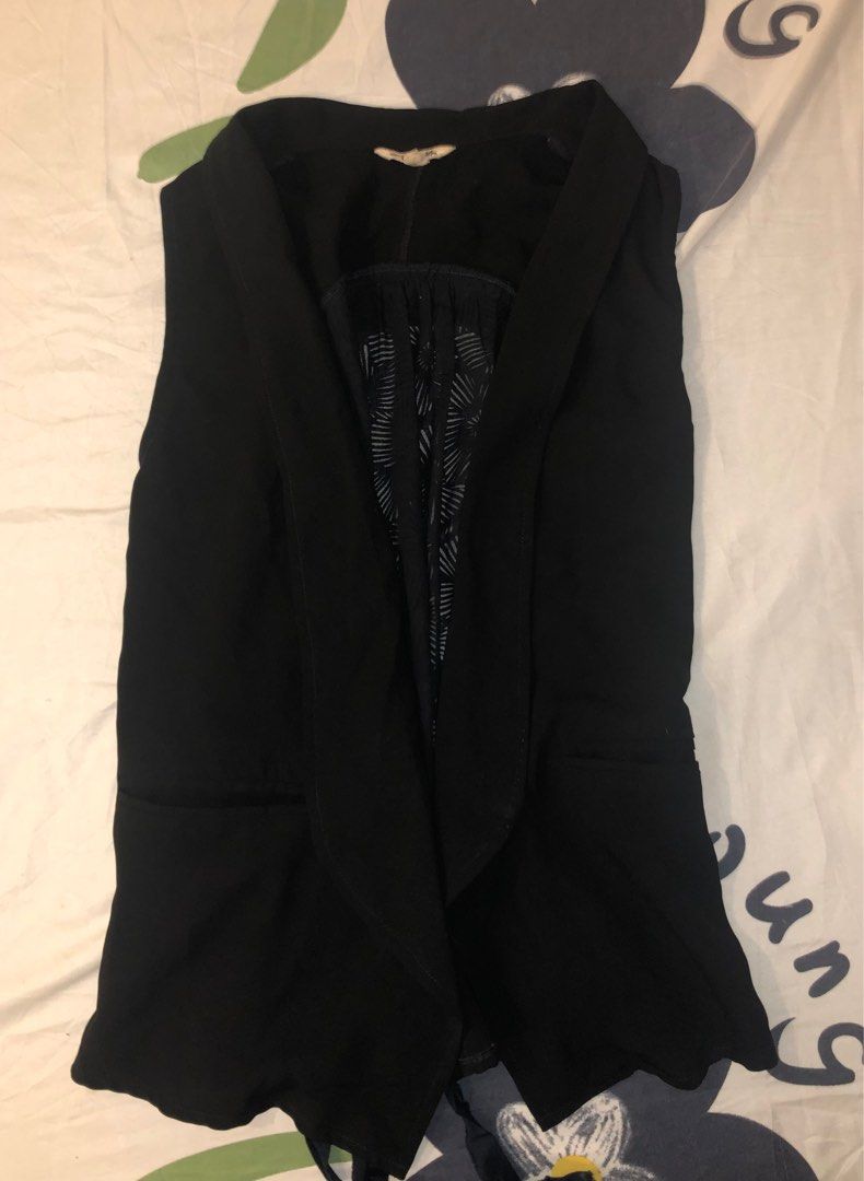 Black Sleeveless Vest (Category: Sleeveless) located in Taytay. Submitted by storedbys (Listing ID 1404871785, Image 1). Description: - black sleeveless vest - unique detailed back panel - draped font - cinched waist with tie detail - lightweight material - versatile for layering - classic style .
