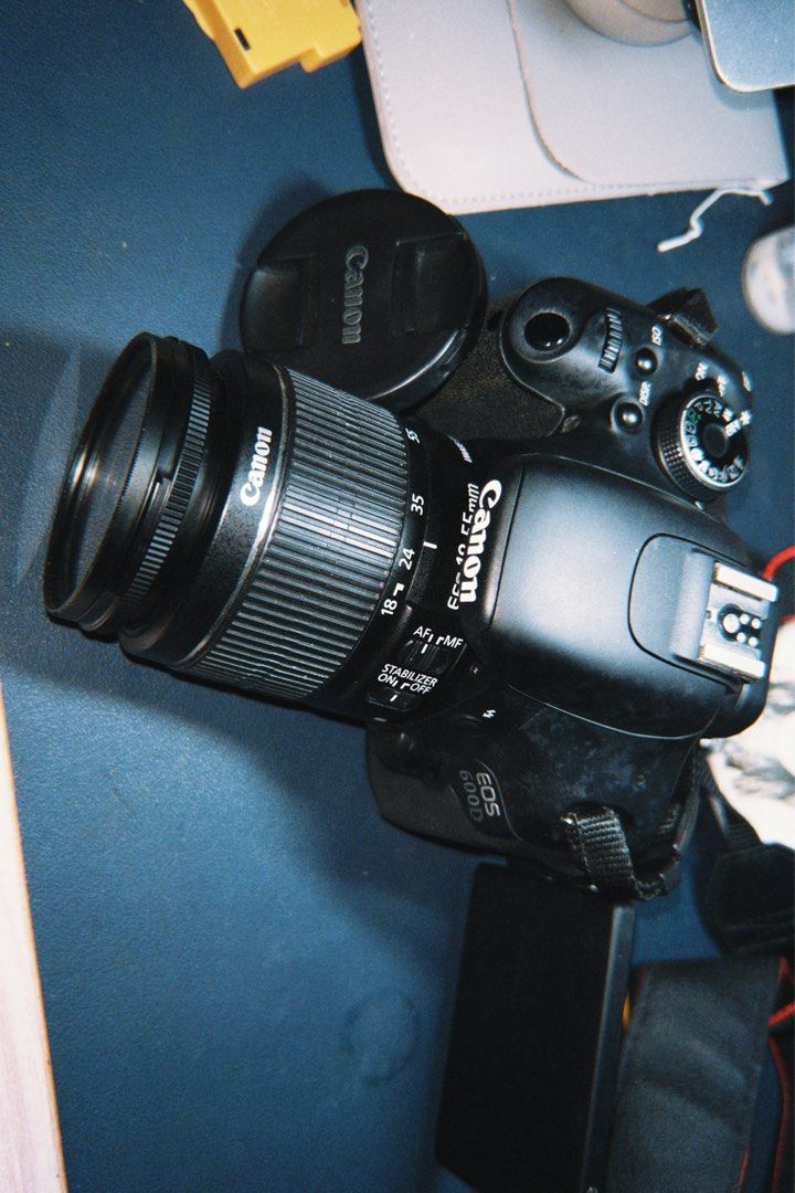 Canon EOS 600D DSLR Camera with Lens (Category: Cameras) located in Cebu City. Submitted by _____08_____ (Listing ID 1404827106, Image 2). Description: - RFS: hasn’t been used anymore (was for college) - Canon EOS 600D DSLR camera - 18-55mm lens included - Features a flip-out LCD screen - Built-in flash - Includes: lens cap, body cap, battery, charger, cables, cleaning cloth, and camera bag (rusty) - Comes with a camera strap - Issue: Last image 