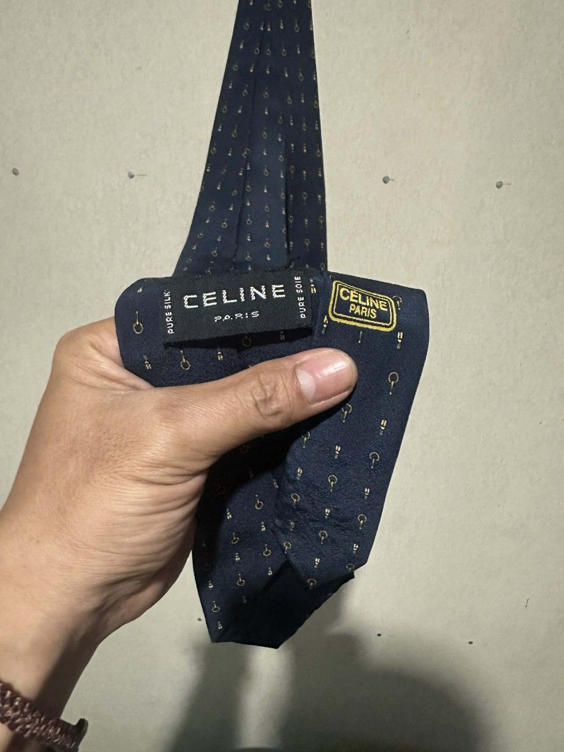 Celine Paris Necktie navy blue featuring repeating gold horse bit pattern (Category: Sets & Coordinates) located in Talacogon. Submitted by clsthrifty (Listing ID 1404863541, Image 1). Description: As new condition 100% silk From Japan Surplus 10/10 color rate 10/10 condition.