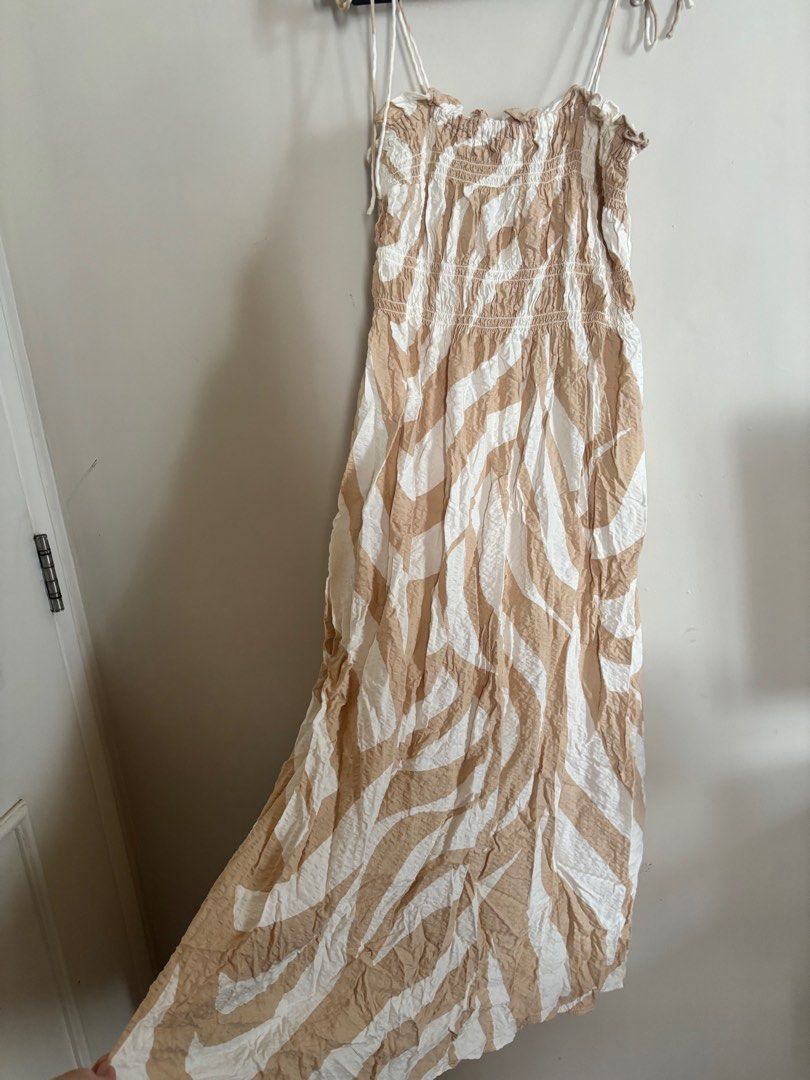 H&M Beige Printed Midi Dress - Size S (Category: Dresses) located in Cainta. Submitted by abbyyyyyyl (Listing ID 1404908718, Image 2). Description: - H&M midi dress - Zebra print (beige and white) - Size: S - Adjustable tie straps - Smocked bodice - Fabric: Viscose & Cotton - Machine washable.