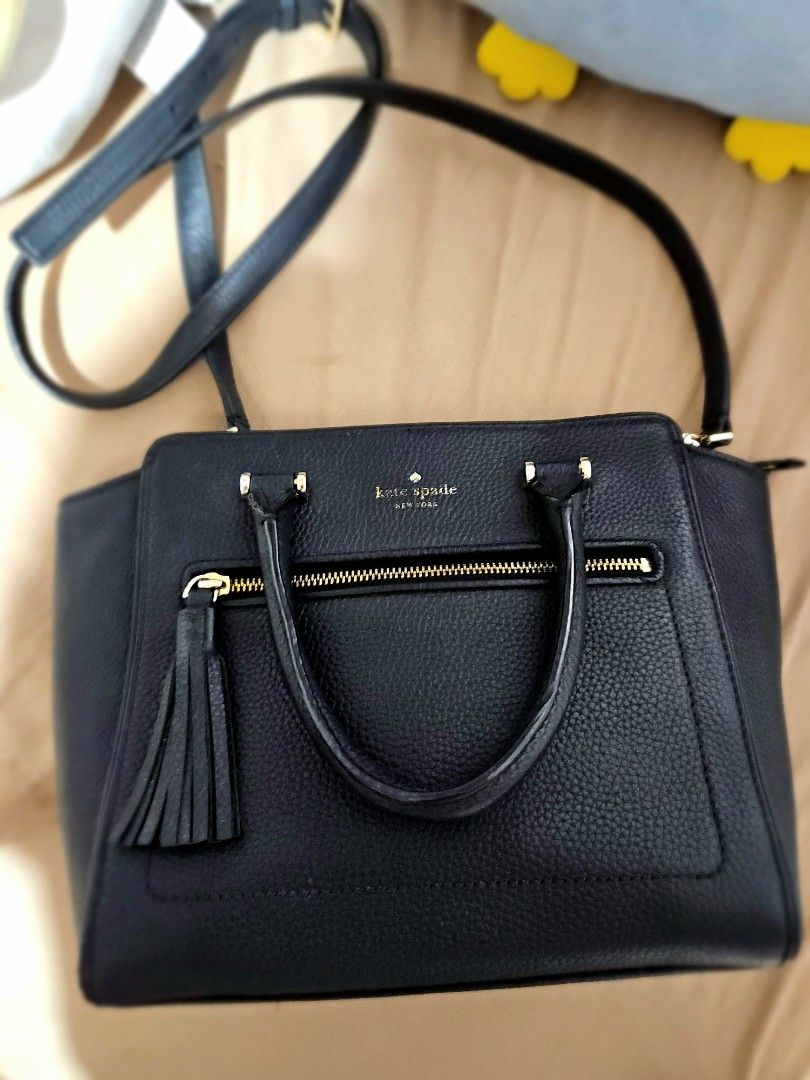 Kate Spade NY chester small allyn (Category: Luxury Bags & Wallets) located in Manila. Submitted by bubba20 (Listing ID 1404832491, Image 3). Description: - Authentic Kate Spade handbag - Top handle and detachable shoulder strap - Front zipper pocket with tassel - Gold-tone hardware - Textured leather exterior - Kate Spade logo visible.