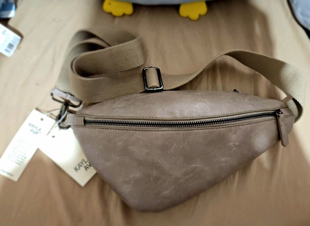Kayla + Ava Sling Bag (Category: Luxury Bags & Wallets) located in Manila. Submitted by bubba20 (Listing ID 1404833007, Image 2). Description: - Stylish sling bag - Zippered main compartment - Adjustable strap for comfort - Made of Vegan Leather - Features a brand tag - Perfect for carrying essentials.