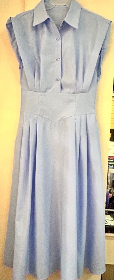 Light Blue Sleeveless Dress (Category: Dresses) located in Cavite. Submitted by xaleene (Listing ID 1404795800, Image 1). Description: - Light blue midi dress - Collared neckline - Button-down front - Fitted waist - Pleated skirt - Sleeveless design - Lightweight fabric - Ideal for warm weather.