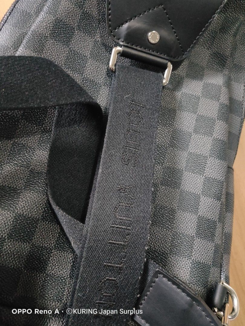 Louis Vuitton Damier Graphite Sling Bag (Category: Luxury Bags & Wallets) located in Batangas. Submitted by ems10. (Listing ID 1404810091, Image 3). Description: Authentic Louis Vuitton Damier Graphite sling bag. Features a checkered pattern with multiple patches. Includes a main compartment with a zipper closure and an adjustable strap. The interior has a small pocket and a Louis Vuitton label. Made in France. The bag has silver-tone hardware an