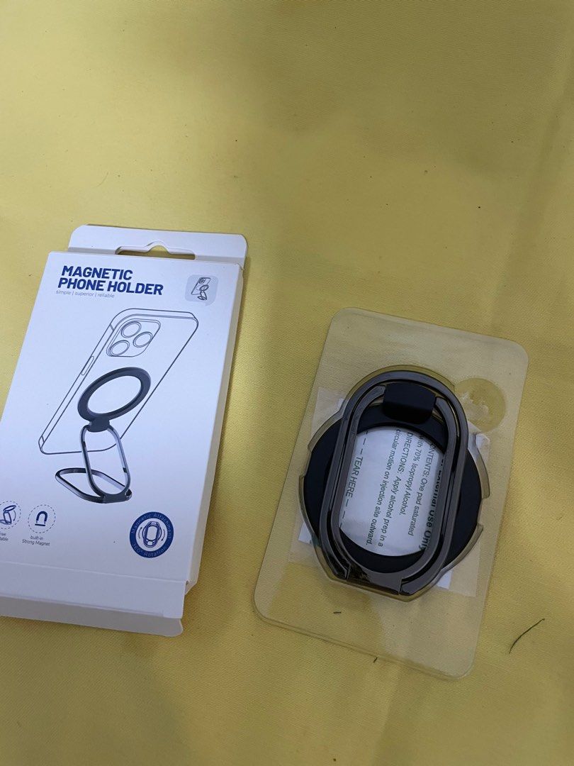Magnetic Phone Holder Black (Category: Mounts & Holders) located in Manila. Submitted by winnieyols (Listing ID 1404906850, Image 1). Description: Magnetic phone holder is designed for iPhone 12/13/14 series and MagSafe phone cases. It features a foldable design for multi-angle usage. It sticks on and off very conveniently and has strong magnetic suction. It also does not affect wireless charging and leaves no traces when removed. The color is BL