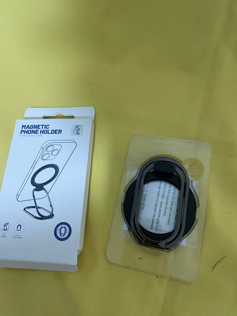 Magnetic Phone Holder Black (Category: Mounts & Holders) located in Manila. Submitted by winnieyols (Listing ID 1404906850, Image 2). Description: Magnetic phone holder is designed for iPhone 12/13/14 series and MagSafe phone cases. It features a foldable design for multi-angle usage. It sticks on and off very conveniently and has strong magnetic suction. It also does not affect wireless charging and leaves no traces when removed. The color is BL