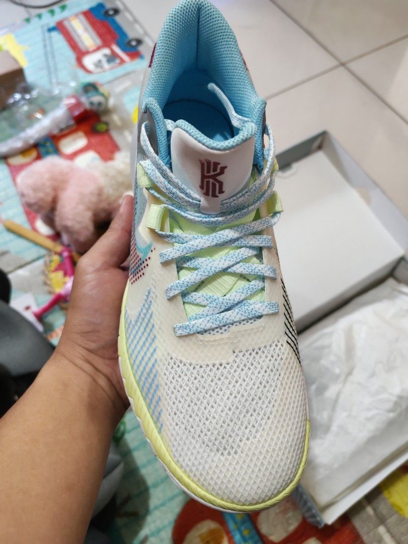 Nike Kyrie Flytrap V EP 1 WORLD 1 PEOPLE (Category: Sneakers) located in Manila. Submitted by AlingSuping (Listing ID 1404835108, Image 3). Description: - Nike Kyrie Flytrap V EP 1 WORLD 1 PEOPLE - Condition: Used 2x (mall walking) // No sole seps nor heel drags - Color: White and Grey - Sole: Blue and Yellow - Laces: Blue - Sizes: US 9.5 - Features Kyrie logo on the tongue - Comes with original box - SF is shouldered by the buyer.