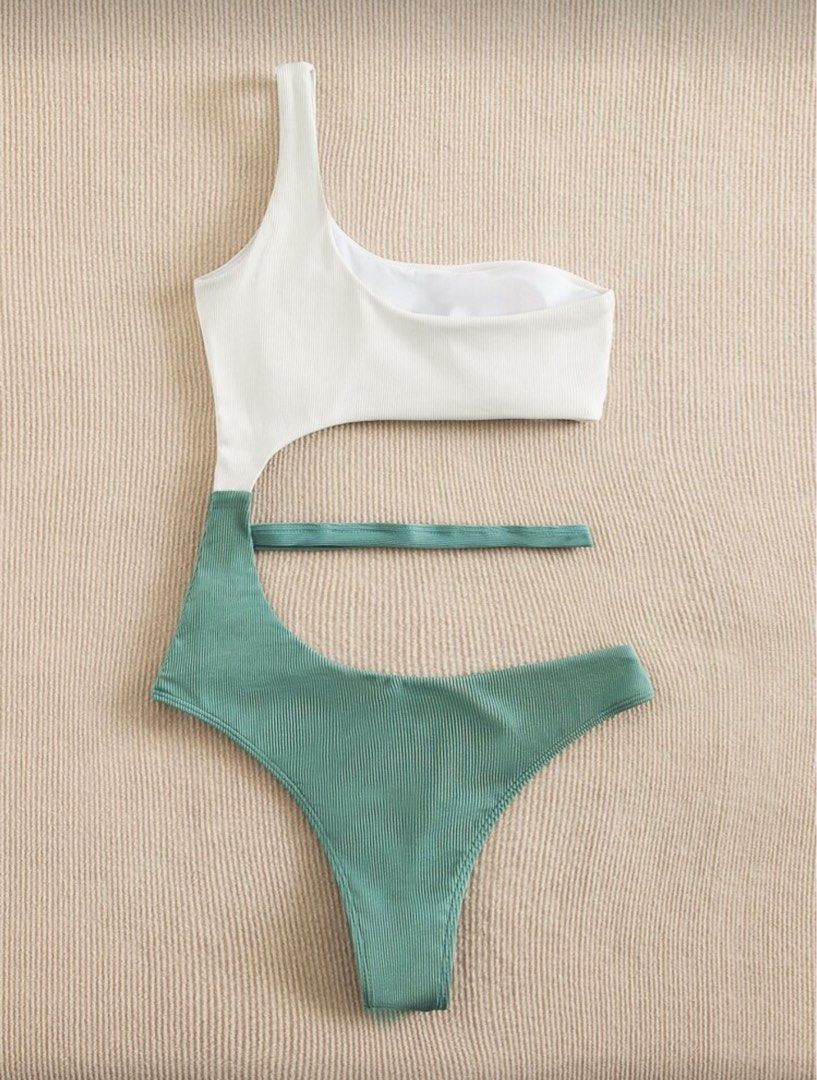 Two Tone Rib One Shoulder One Piece Swimsuit (Category: Bikinis & Swimsuits) located in Quezon City. Submitted by dettesy (Listing ID 1404908328, Image 1). Description: Never used. Make waves in style! One-shoulder swimsuit with a unique cutout design. Chic white top meets teal green ribbed bottom for a trendy, flattering look. Perfect for pool days or beach vibes—turn heads wherever you go. .