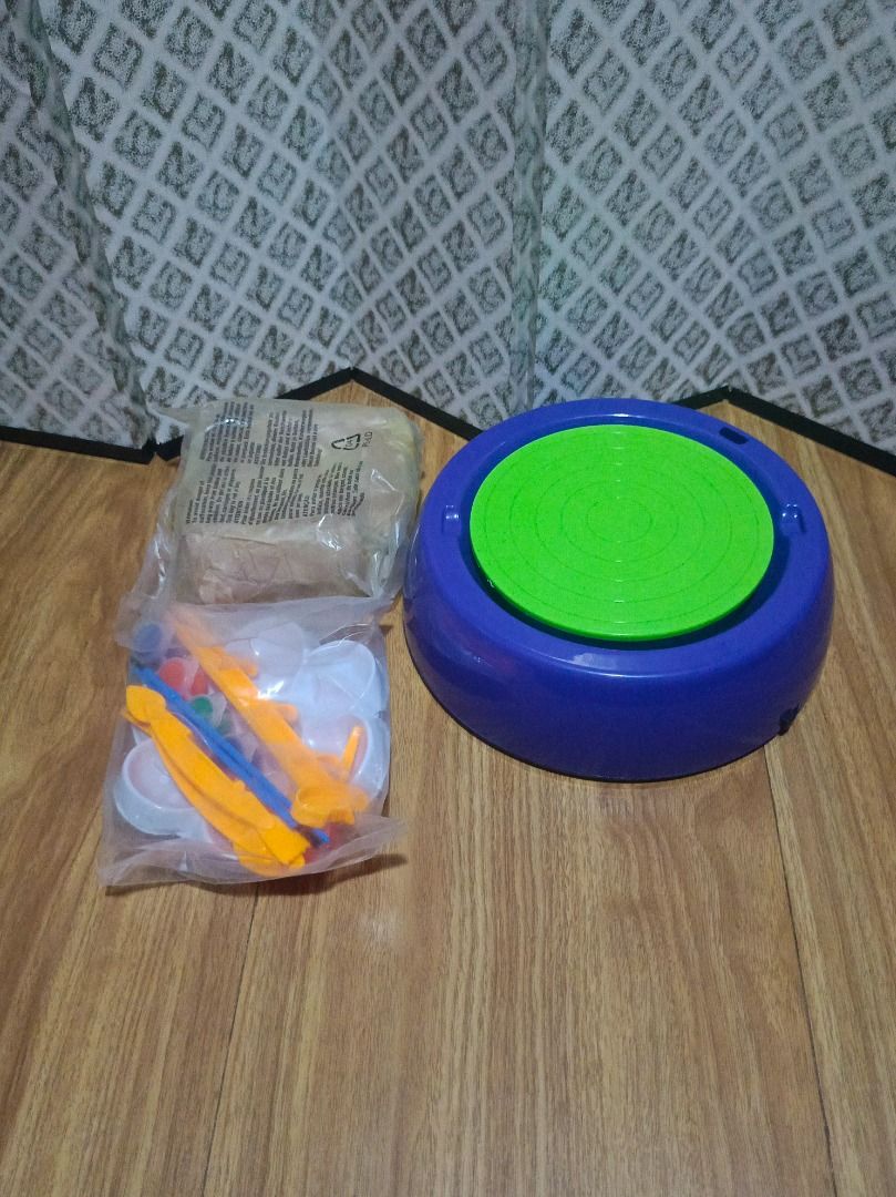 Rokuko Pottery Wheel Kit (Category: Craft Supplies & Tools) located in Makati City. Submitted by nyxhemera26 (Listing ID 1404958245, Image 2). Description: Rokuko pottery wheel kit includes a pottery wheel, clay, tools, and paints. It features a 2-speed setting. The wheel requires batteries (sold separately). The box shows some wear. • UNUSED BUT BOX IS NO LONGER IN GOOD • UNTESTED (I DON'T HAVE SPARE BATTERY) .