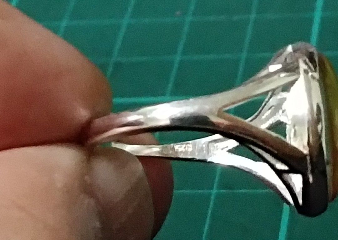 (size 9) 100% Legit Genuine 925 Silver Ring with Yellow Round Moon-dome Glass (Category: Rings) located in Manila. Submitted by mhar_declutter (Listing ID 1404881469, Image 3). Description: - pure 925 Silver ring - Yellow Round Moon-dome Glass - Band marked "925" - Adjustable size - Suitable for everyday wear or special occasions.