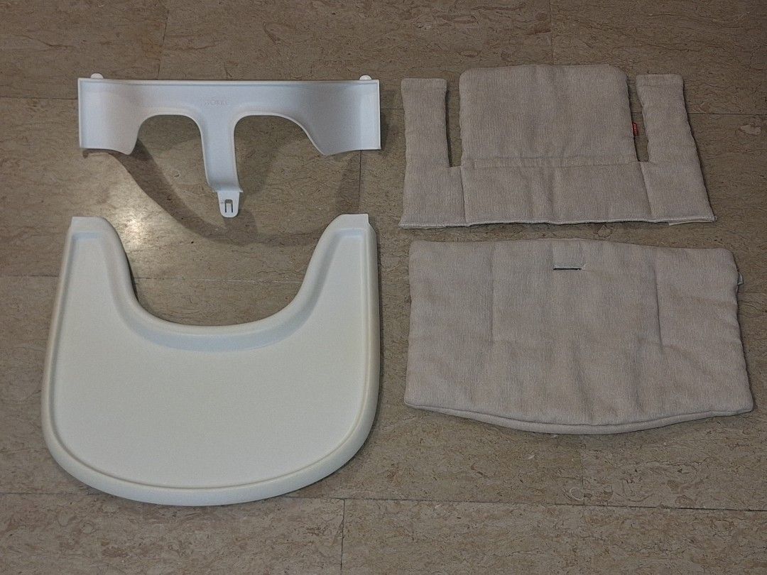 Stokke chair table and protection with cushion beige color (Category: Baby High Chairs) located in Singapore. Submitted by christ.n (Listing ID 1404777461, Image 1). Description: pickup Haig road 438791.