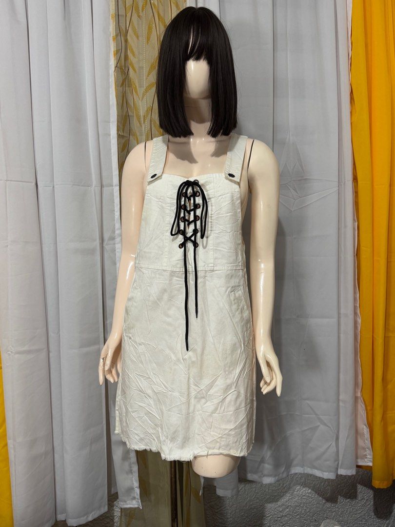 White Denim Lace-Up Mini Dress (Category: Dresses) located in Quezon City. Submitted by everydayessentialsstudio (Listing ID 1359625830, Image 2). Description: A cute white denim mini dress featuring a lace-up ribbon detail in front. Slightly structured, stylish, and perfect for casual days. #DenimDressPH #WhiteDress #PrelovedFinds #ClosetReVibe #CasualChic.