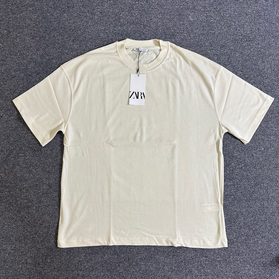 Zara Cream Tshirt (Category: Tshirts & Polo Shirts ) located in Quezon City. Submitted by leaneder23 (Listing ID 1404855664, Image 3). Description: Zara Cream T-shirt Brand new Sobrang nice ng design and fabric Bought at Zara SM Megamall Natambak lang sa cabinet The sizing runs a little bit big Ganda fitting sa 5’8” 70 kg Length: 27.5 inches Width: 22.5 inches (Perfume not included) Location: Quezon City RFS: Decluttering.
