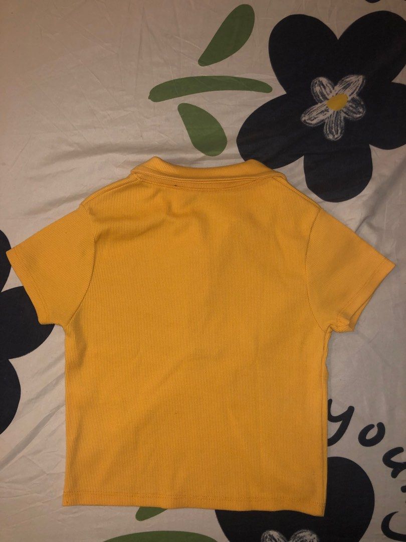 Zara Yellow Polo Shirt (Category: Shirts) located in Taguig. Submitted by teresitap10129 (Listing ID 1404858772, Image 2). Description: - Zara yellow polo shirt - Collared neckline - Short sleeves - Button-down front - Ribbed texture - Cropped style - Plain yellow back If you buy 2 or more from my listings you can get this for free! :)).