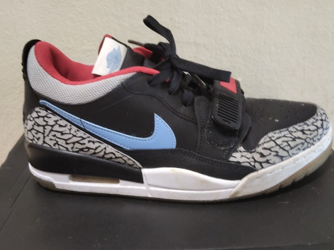 Air Jordan Legacy 312 Low - Black/Wolf Grey (Category: Sneakers) located in Kuching. Submitted by xwhitezdyl63380 (Listing ID 1405048307, Image 2). Description: - Air Jordan Legacy 312 Low sneakers - Color: Black, wolf grey, and valor blue - Features: Light blue swoosh, elephant print detailing, velcro strap with "NIKE" branding - Size: US 9, UK 8, EUR 42.5 - Includes original box -DM ME BEFORE U BUY -ONLY ACCEPT TNG AND GRABPAY.
