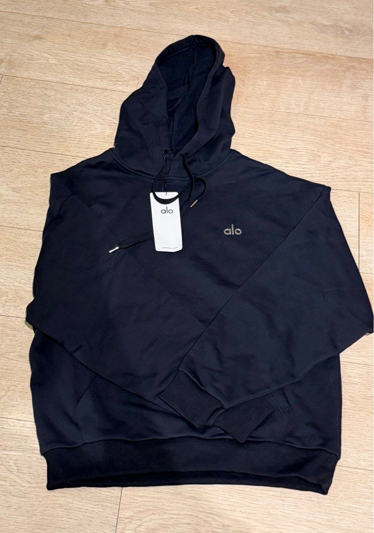 Alo Navy Hoodie - M (Category: Coats, Jackets and Outerwear) located in Singapore. Submitted by livchambo (Listing ID 1405095035, Image 3). Description: - Brand new Alo hoodie - Navy color - Size M - Classic design with Alo logo - Ideal for casual wear and workouts - Unworn condition.