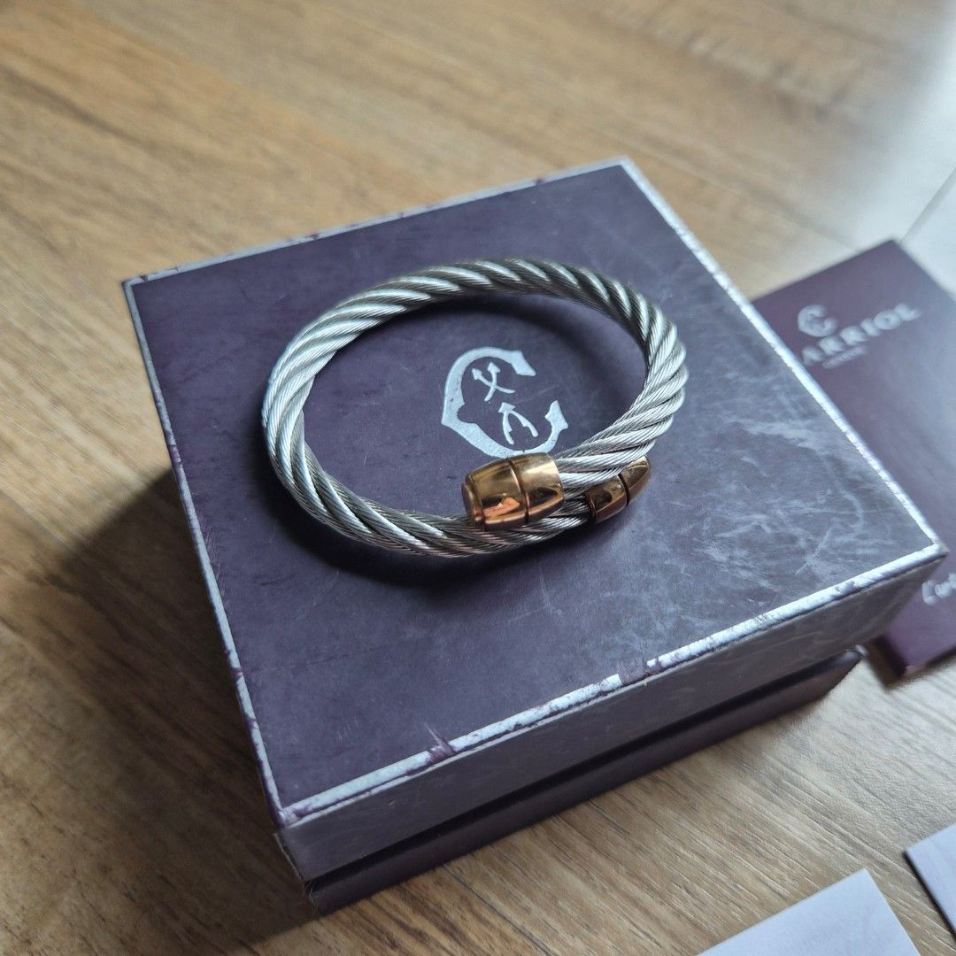 Charriol Celtic Barrel Cable Bracelet (Category: Bracelets) located in Quezon City. Submitted by jerikav (Listing ID 1405047311, Image 1). Description: CHARRIOL CELTIC BARREL BANGLE Orig. price : Php12,500 - Authentic Charriol bracelet - Twisted stainless steel cable design - Rose gold-tone barrel accents - Size Small - Includes original box, warranty card, product information cards *see photos for bangle and box condition. .