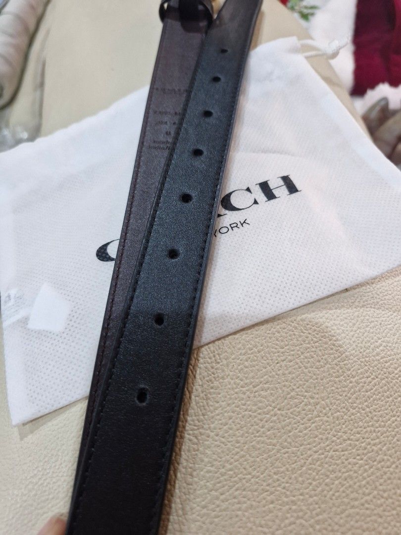 Coach Belt with Gold Buckle (Category: Belts) located in Marikina City. Submitted by mariantherese (Listing ID 1404976767, Image 2). Description: - Black Coach belt with gold buckle - Adjustable with multiple holes - Brown interior with Coach logo and size details - Includes Coach dust bag - Made in India - Fits M-L - added a hole - used 2x only.