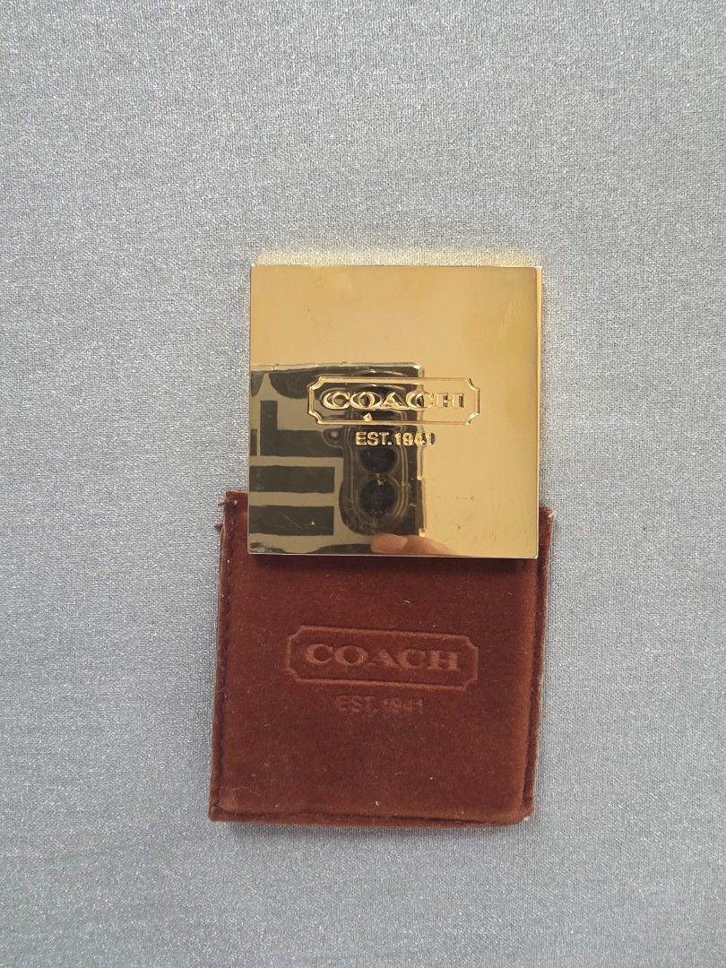 Coach Compact Mirror (Category: Mirrors) located in Mandaue City. Submitted by scarletnate_eshop (Listing ID 1405041184, Image 1). Description: - Gold-tone Coach compact mirror - Comes with a brown, velvet-like case - Coach logo displayed on mirror and case - Square-shaped mirror - Free shipping.