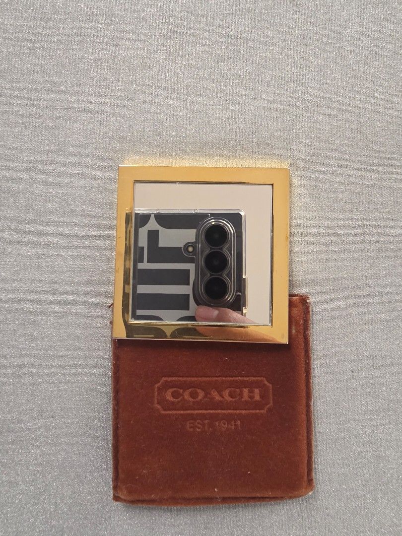 Coach Compact Mirror (Category: Mirrors) located in Mandaue City. Submitted by scarletnate_eshop (Listing ID 1405041184, Image 2). Description: - Gold-tone Coach compact mirror - Comes with a brown, velvet-like case - Coach logo displayed on mirror and case - Square-shaped mirror - Free shipping.