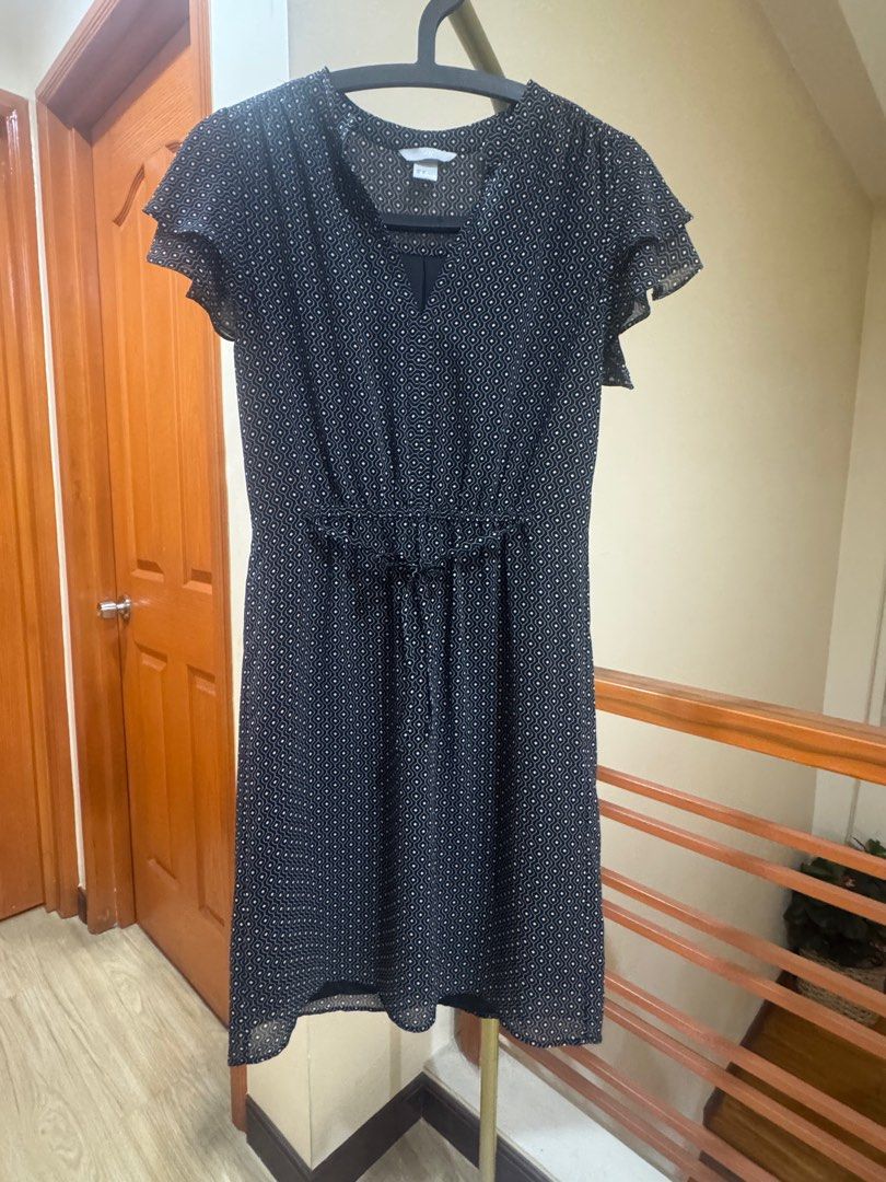Dress H&M Polka Dot with Flutter Sleeves (Category: Dresses) located in Taytay. Submitted by miley_kay (Listing ID 1405062349, Image 1). Description: - Black dress with white polka dots - Features a flattering V-neckline - Designed with flutter sleeves - Cinched waist for a defined silhouette - Made from lightweight, flowy fabric - Knee-length - Size when laid flat: Bust 44cm, Waist 36cm, Length 89cm.