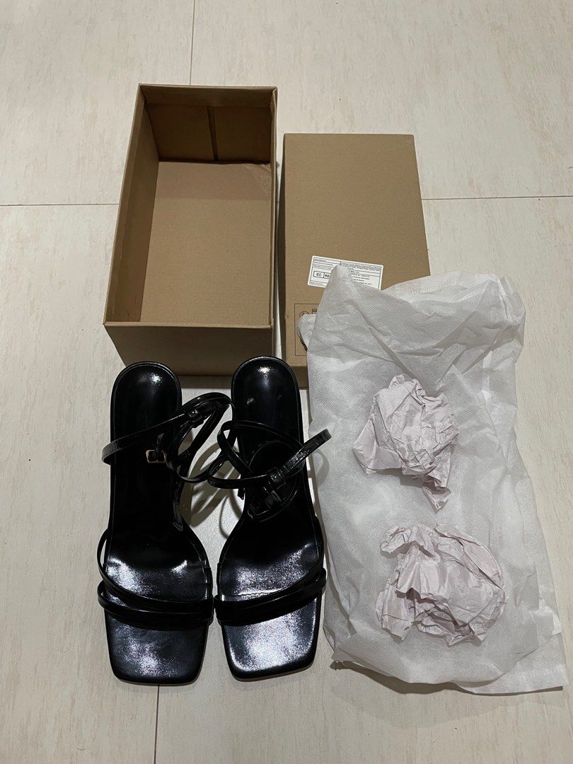 Glossy Black Strapped Heels (Category: Heels) located in Quezon. Submitted by khydeclutterz (Listing ID 1405096509, Image 1). Description: - Bought sa SHE IN for 800+ - Used three times, for events only. Good as new condition. - SIZE 39 (24.5cm) (9) | HEEL 3.4 Inches - Comes with original box, shoe dust bag + paper. - Slightly Negotiable. Bought this Feb lang. WILL CLEAN PA BEFORE SHIPPING, CHECK LAST PIC FOR WHEN WORN ‼️ MOP: Maya | Gcash | Bank